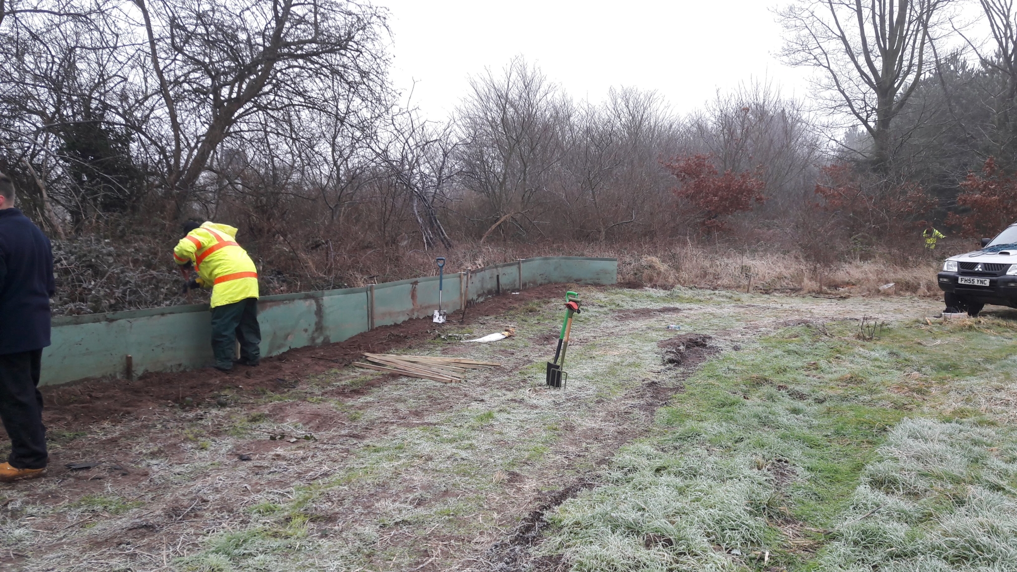A photo from the FoTF Conservation Event - January 2018 - Erecting the Toad Fence at Cranwich : A volunteer works on a section of the fence