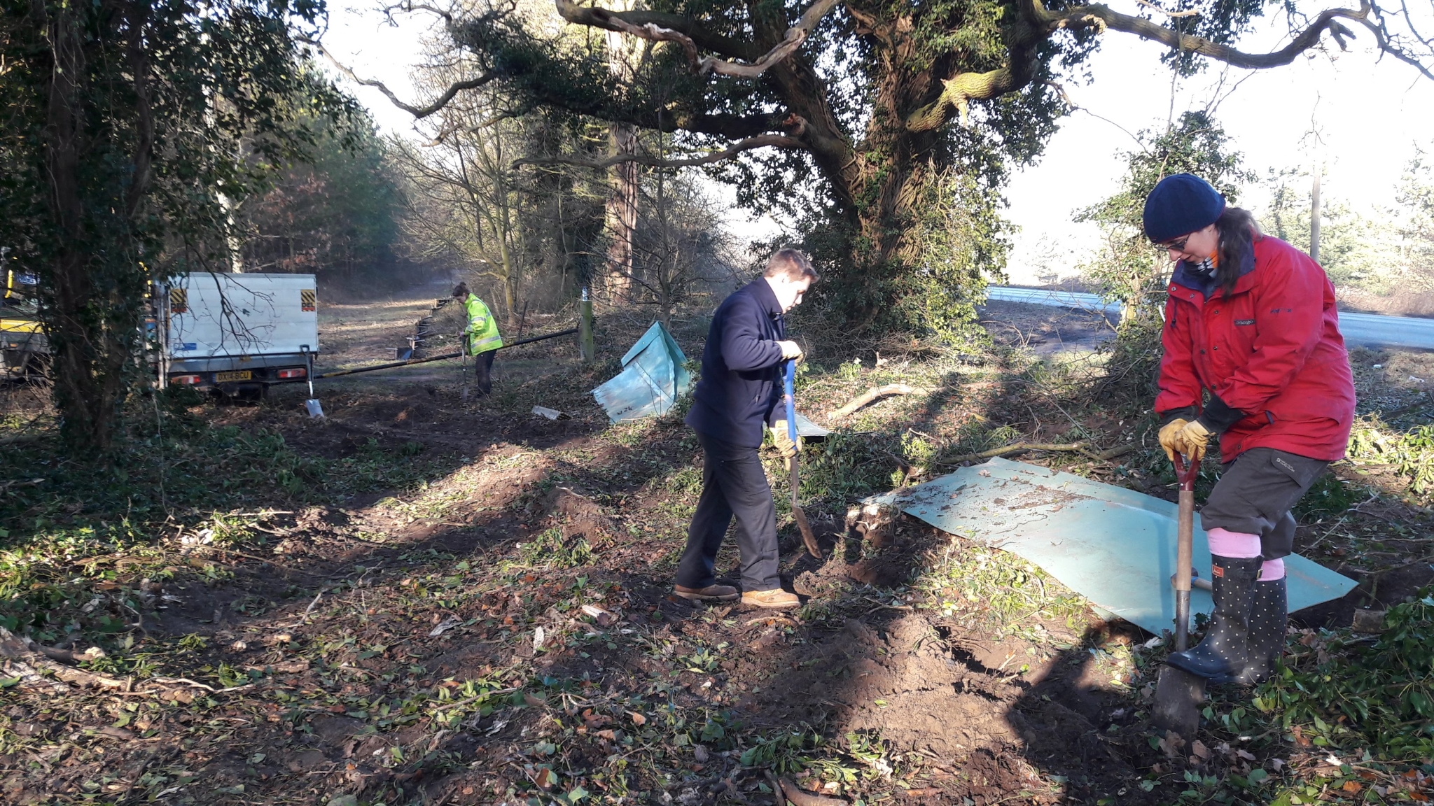 A photo from the FoTF Conservation Event - February 2018 - Erecting the Toad Fence at Cranwich : Volunteers work on a section of the fence