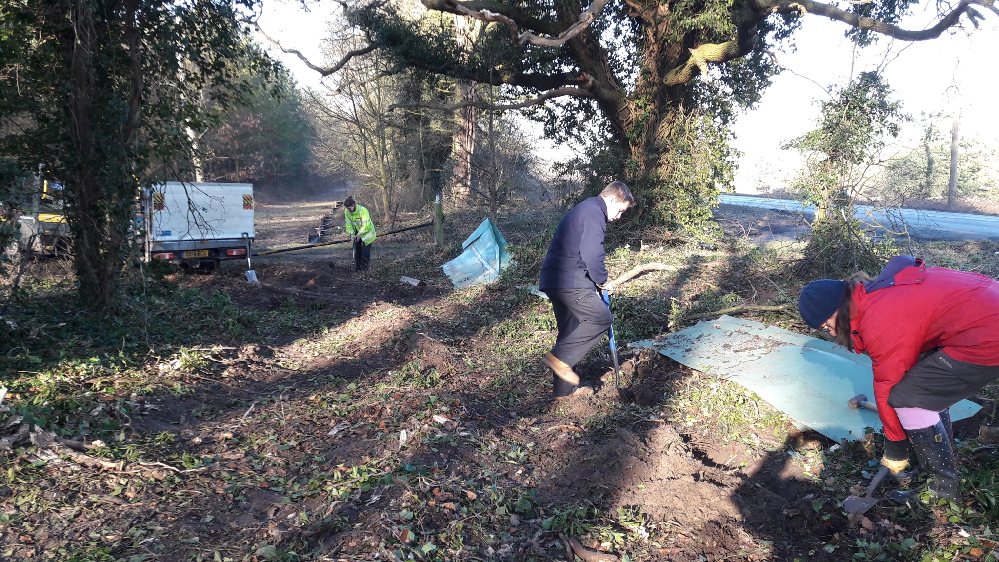 A photo from the FoTF Conservation Event - February 2018 - Erecting the Toad Fence at Cranwich : Volunteers work on a section of the fence