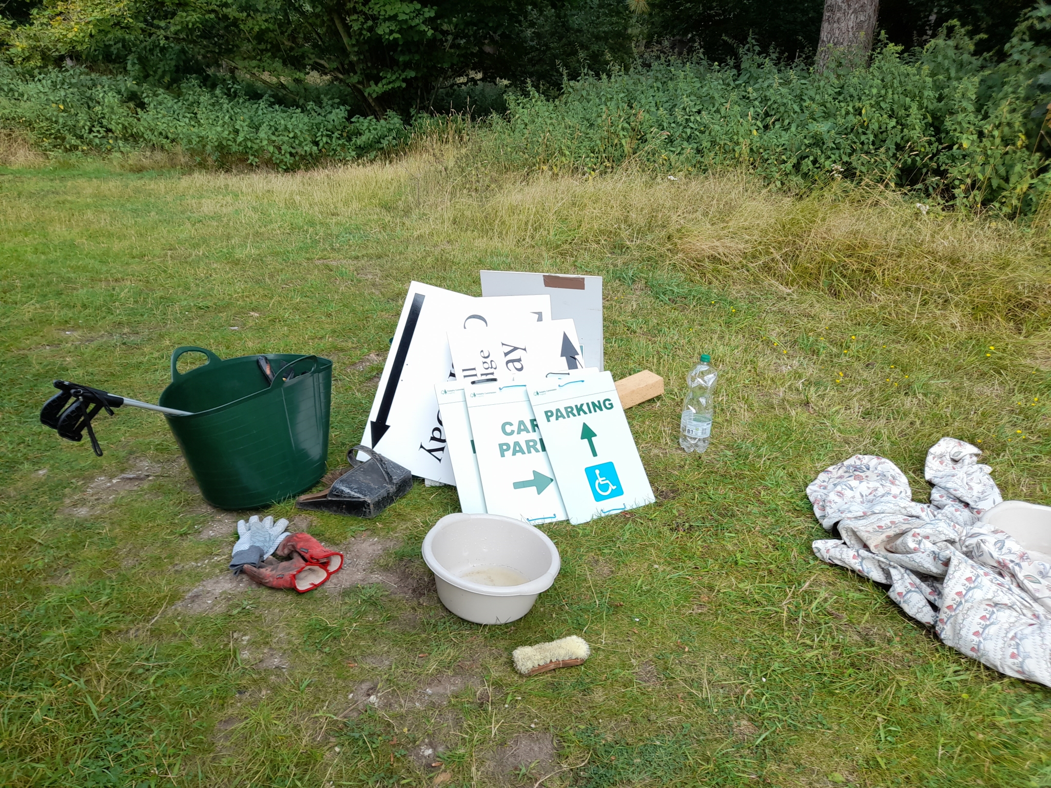 A photo from the FoTF Conservation Event - August 2021 - Maintenance tasks at Mildenhall Mugwort Pit & Mildenhall Warren Lodge : Some of the volunteers equipment is laid out on the ground